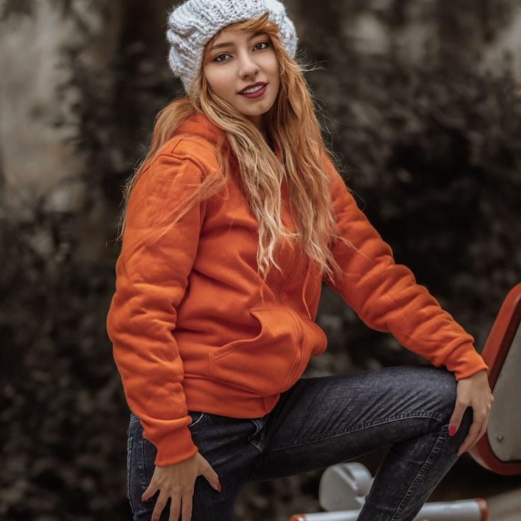 Avery Chen, Lead Design Curator at Sky Eve Quarry, reviewing corporate floral arrangements